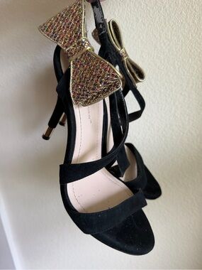 BCBGeneration Black Strappy Heels with Gold Bow Accent Date Night Sparkle